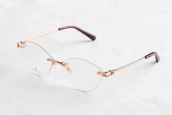 frameless eyeglasses on white surface
