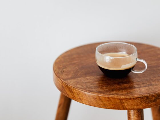 cup of black coffee on round table