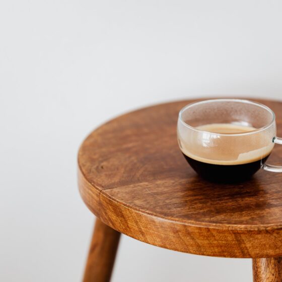 cup of black coffee on round table