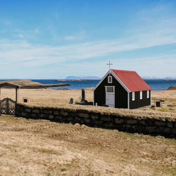 lonesome wooden church on desolated river coast