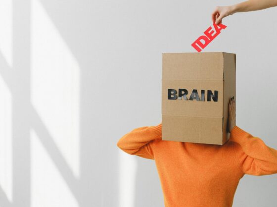 box with brain inscription on head of anonymous woman