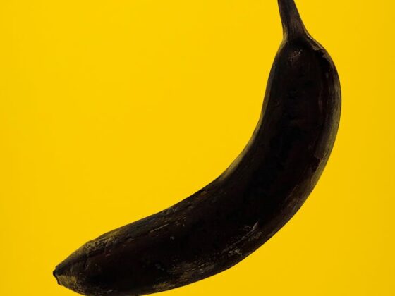 rotten banana on yellow background