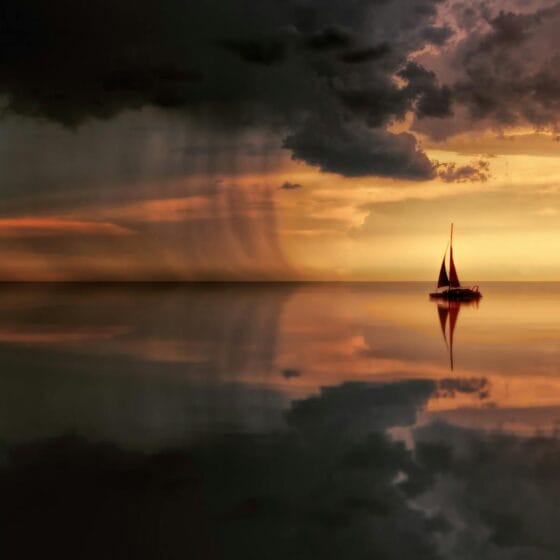 silhouette photography of boat on water during sunset