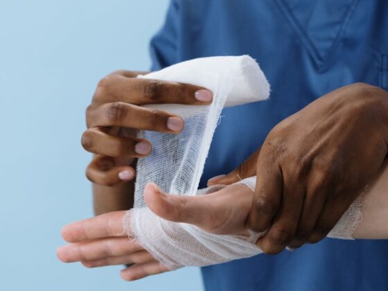 a person getting his hand bandaged