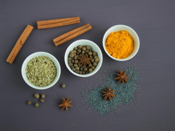 assorted spices near white ceramic bowls