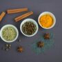 assorted spices near white ceramic bowls