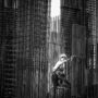 Black and white image of a construction worker climbing steel frameworks in Batumi, Georgia.