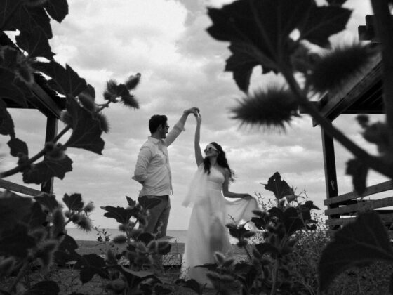 A couple dances romantically among wild plants at an outdoor wedding in Antalya.