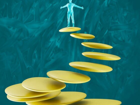 a man standing on top of a set of yellow plates